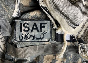 SAINT PETERS, MISSOURI - December 1, 2020: An ISAF Forces patch is affixed to a digital camouflage body armor. ISAF's role in Afghanistan began in 2001 and they are still active today.