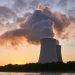 a nuclear power plant emitting smoke in air