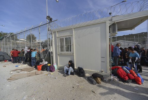 LESVOS, GREECE - october 14, 2015. Refugee migrants, arrived on Lesvos in dinghy boats, they wait in refugee camps for the ferry to Athens continuing their journey through Europe to seek asylum.