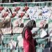 Iran's Parliamentary Election / Tehran , Iran - 21 February 2016 : Persian girl passing by posters of candidates of parliamentary election