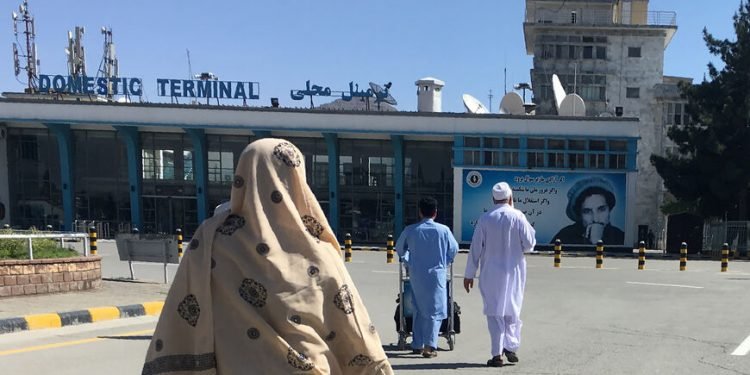 This photo taken on May 8, 2018, shows people arriving at the domestic terminal of the Hamid Karzai International Airport of Kabul. (Photo by Dominique FAGET / AFP)        (Photo credit should read DOMINIQUE FAGET/AFP via Getty Images)