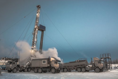 Drilling a deep well with a drilling rig at an oil and gas field. The deposit is located in the Far North beyond the Arctic Circle. The shooting was conducted in the winter during the polar day