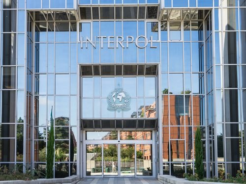 LYON, FRANCE - SEPTEMBER 21, 2015: Facade of the Interpol headquarter. INTERPOL is an intergovernmental organization facilitating international police cooperation.