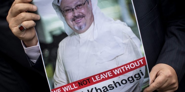 ISTANBUL, TURKEY - OCTOBER 08:  A man holds a poster of Saudi journalist Jamal Khashoggi during a protest organized by members of the Turkish-Arabic Media Association at the entrance to Saudi Arabia's consulate on October 8, 2018 in Istanbul, Turkey. Fears are growing over the fate of missing journalist Jamal Khashoggi after Turkish officials said they believe he was murdered inside the Saudi consulate. Saudi consulate officials have said that missing writer and Saudi critic Jamal Khashoggi went missing after leaving the consulate, however the statement directly contradicts other sources including Turkish officials. Jamal Khashoggi a Saudi writer critical of the Kingdom and a contributor to the Washington Post was living in self-imposed exile in the U.S.  (Photo by Chris McGrath/Getty Images)