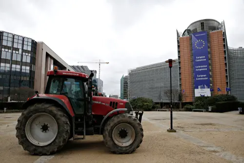 Tractors,Are,Seen,Outside,Of,Eu,Commission,Headquarters,As,Farmers