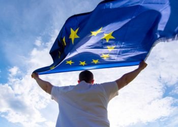 Man,Holding,Eu,Flag,Or,European,Union,Flag,,Concept,Picture