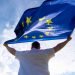 Man,Holding,Eu,Flag,Or,European,Union,Flag,,Concept,Picture