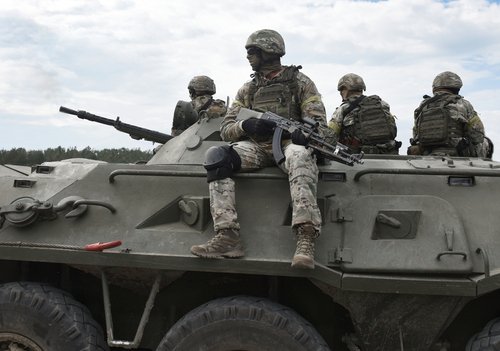 Soldiers,With,Machine,Guns,On,An,Armored,Personnel,Carrier.,Post-soviet