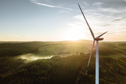 Wind,Turbine,In,The,Sunset,Seen,From,An,Aerial,View