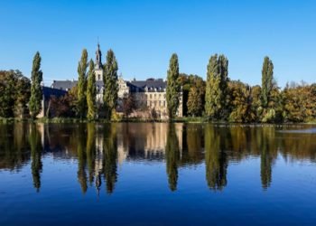 The,Abbey,Of,The,Park,Reflecting,In,The,Pond,In