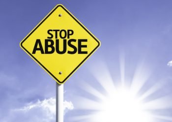 Stop,Abuse,Road,Sign,With,Sun,Background