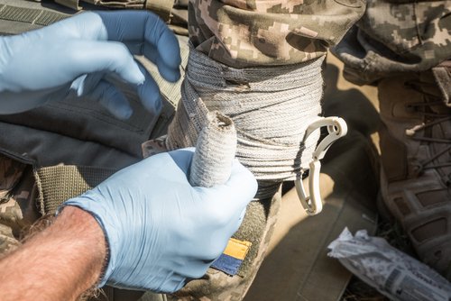 Bandaging,The,Damdged,Hand,Of,A,Ukrainian,Soldier,,Close-up.