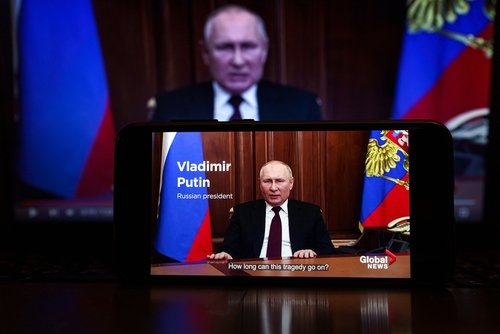 Moscow, Russia - 2022 February 22: Vladimir Putin on the news. President of Russia speech on TV. Russia and Ukraine war