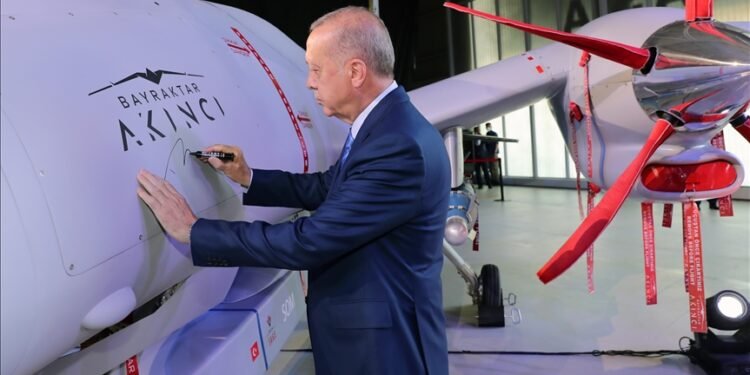 Recep Tayyip Erdogan signing on Turkish made combat drone