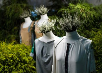 White,Mannequins,,,With,Heather,On,A,Dark,Green,Forest