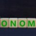 Taxonomy,Or,Economy,Symbol.,Turned,Wooden,Cubes,And,Change,The