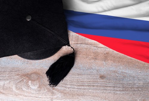 Black,Graduation,Hat,On,Russia,Flag,,Education,Concept,,Top,View