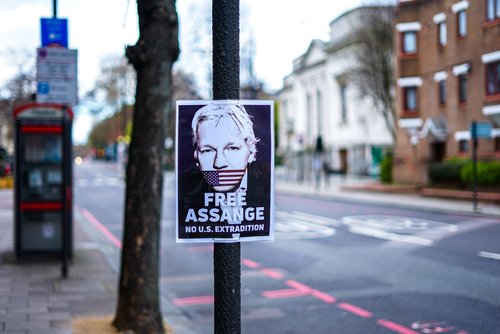 London, UK - March 2020: Signs in support of the Free Julian Assange Campaign on Upper street in North London