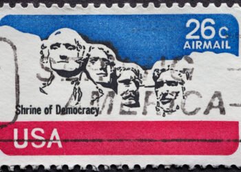 USA - Circa 1974 : a postage stamp printed in the US showing the Mount Rushmore Text: shrine of democracy United States Air Mail