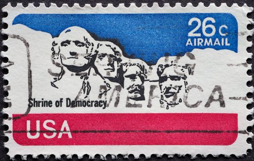 USA - Circa 1974 : a postage stamp printed in the US showing the Mount Rushmore Text: shrine of democracy United States Air Mail