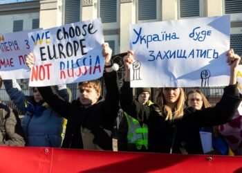 KYIV, UKRAINE - Feb. 22, 2022: The empire must die. Protest action near the Embassy of the Russian Federation in Kiev. Text - Empire must die, Ukraine will defend