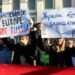 KYIV, UKRAINE - Feb. 22, 2022: The empire must die. Protest action near the Embassy of the Russian Federation in Kiev. Text - Empire must die, Ukraine will defend