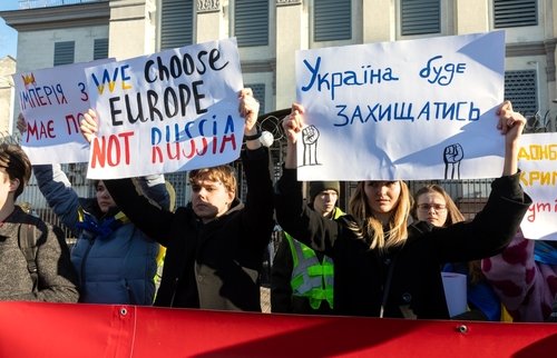 KYIV, UKRAINE - Feb. 22, 2022: The empire must die. Protest action near the Embassy of the Russian Federation in Kiev. Text - Empire must die, Ukraine will defend