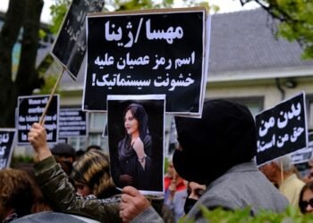 Protestors take part during a demonstration in front of the Iranian embassy in Brussels, Belgium on Sept. 23, 2022, following the death of Mahsa Amini.