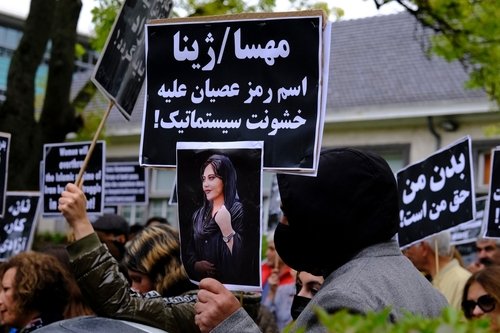 Protestors take part during a demonstration in front of the Iranian embassy in Brussels, Belgium on Sept. 23, 2022, following the death of Mahsa Amini.