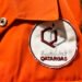 Orange,Workwear,With,Logo,In,Arabic,And,English.,Qatargas,Is