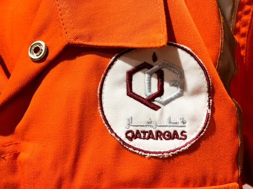 Orange,Workwear,With,Logo,In,Arabic,And,English.,Qatargas,Is