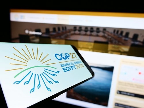 Stuttgart, Germany - 09-22-2022: Smartphone with logo of 2022 UN Climate Change Conference (COP27) on screen in front of website. Focus on center-left of phone display. Unmodified photo.