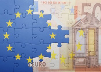 puzzle with the national flag of european union and euro banknote . concept