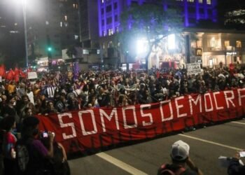 Demonstrators in São Paulo marched with a big banner with the words "We are democracy" in Portuguese