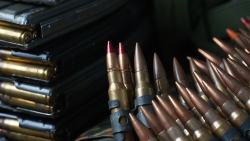 Photo of 5.56mm ammunition, machine gun bullets belt, rifle ammunition