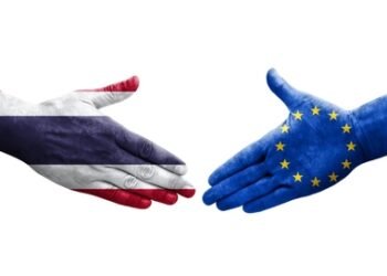 Handshake between European Union and Thailand flags painted on hands, isolated transparent image.