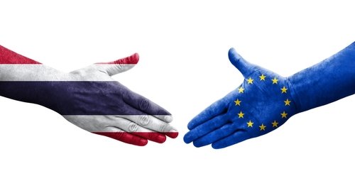 Handshake between European Union and Thailand flags painted on hands, isolated transparent image.