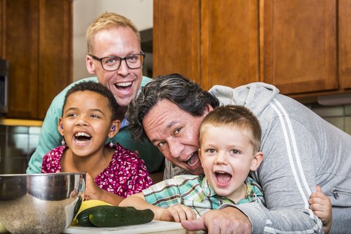 Same,Sex,Couple,And,Kids,Having,Fun,At,Meal,Time