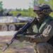 A Polish soldier stands guard and waits for reinforcements after crossing the Narew river during Defender Europe at Lomza, Poland, May 19, 2022. Credit: U.S. Army/Spc. Devin Klecan