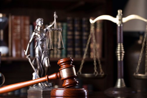 law symbols in courtroom chamber.