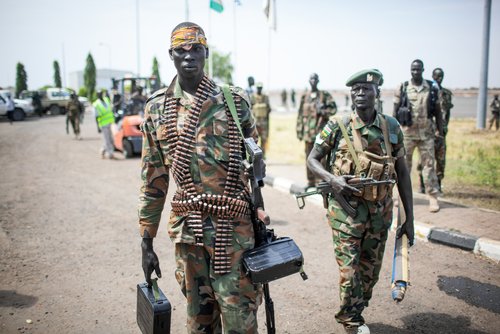 Paloch, South Sudan - March 2, 2014: A South Sudanese soldier carries a machine gun. Credit: Shutterstock