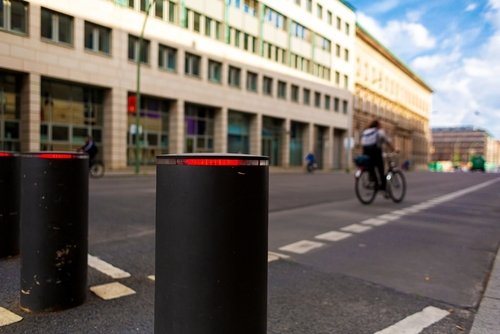 Automatic lifting bollards restricting the driveway of vehicles.