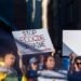 Vancouver, Canada - Jun 6, 2023 - People holding blue cloth and banners asking to stop ecocide in Ukraine