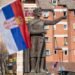 Serbian flag infront of Prince Lazar Hrebljanovic of Serbia statue monument in the Serbian northern part of the divided city of Kosovska Mitrovica. North Kosovska Mitrovica, Kosovo, Serbia 04.03.2022