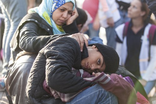 Kos, Greece - October 10, 2015: Syrian refugee and her child at a volunteer's camp