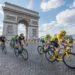 PARIS, FRANCE - JULY 24, 2016 : The road racing cyclist Christopher Froome, wearing the leader's yellow jersey in front of Arc de Triomphe during the Tour de France 2016 on the Champs Elysees Avenue.