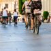 Many people in the city center in the pedestrian zone who walk on foot and by bicycle