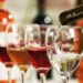 White wine pouring into glasses, closeup