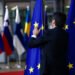 Brussels, Belgium. 28th May 2019.An official adjusts an EU flag in the lobby of the European Council building during the EU Summit.