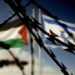 Flags of Israel and Palestine and barbed wire